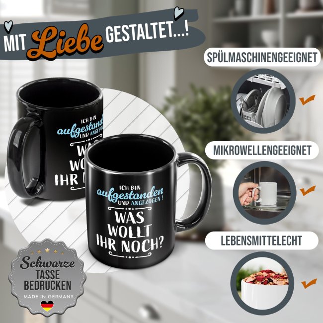 Schwarze Tasse mit Spruch - Aufgestanden und angezogen - Was wollt ihr noch?