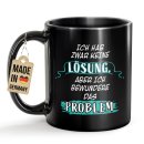 Schwarze Tasse mit Spruch - Bewundere das Problem