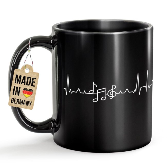 Schwarze Musik-Tasse mit Motiv - EKG-Noten