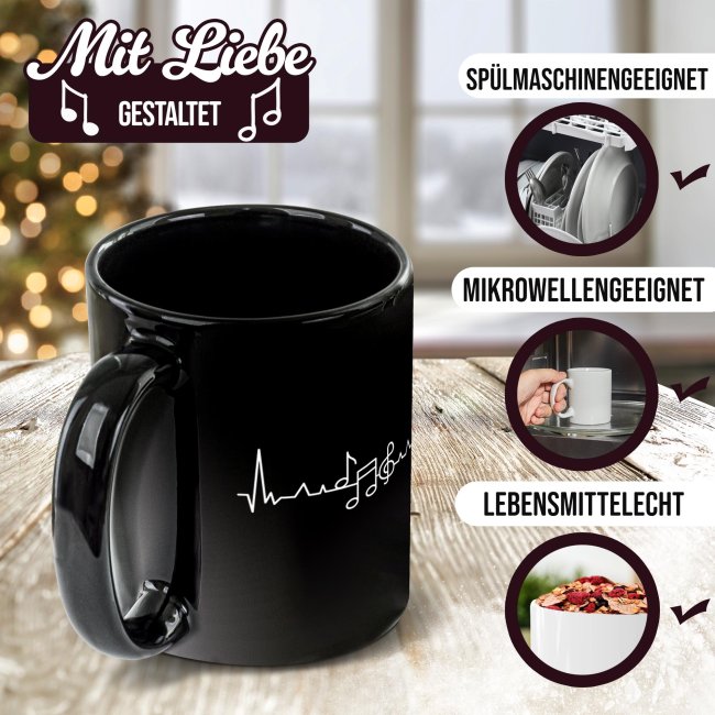 Schwarze Musik-Tasse mit Motiv - EKG-Noten