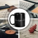 Schwarze Musik-Tasse mit Motiv - EKG-Noten